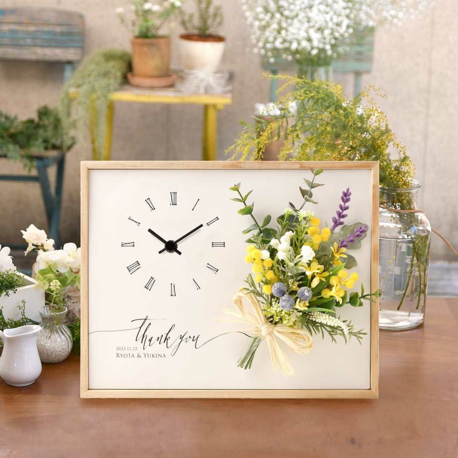 お二人の結婚式を飾ったウェルカムボードとお揃いデザインの両親贈呈品