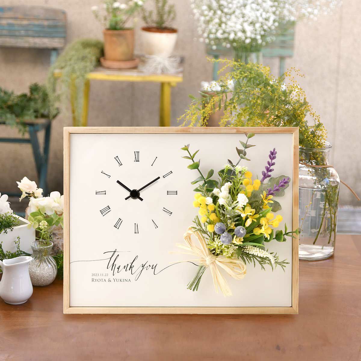 お二人の結婚式を飾ったウェルカムボードとお揃いデザインの両親贈呈品